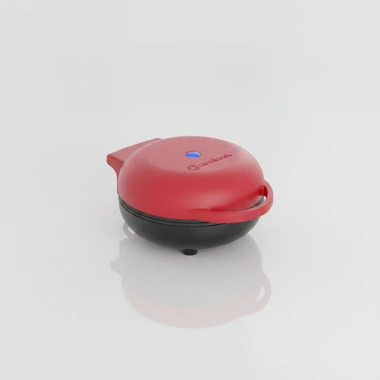 Червен мини гофретник Nutricook Mini Waffle Maker с чиния прясно изпечени гофрети и боровинки